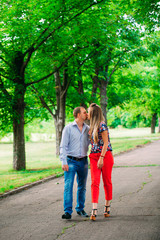 Fototapeta premium Beautiful loving couple going for a walk outdoors