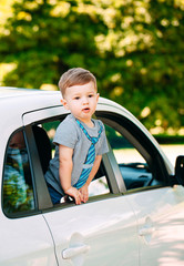 Adorable baby boy in the car