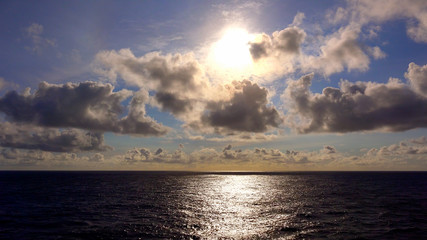 View of The Setting Sun Over the Pacific Ocean From The Deck of