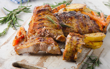 Grilled pork ribs  on wooden cutting board.