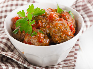 Meatballs with Tomatoes and fresh parsley.