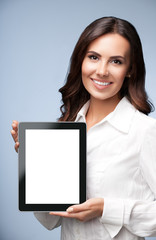 Businesswoman showing blank tablet pc, on grey