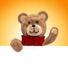 fluffy plush teddy bear toy holding blank holiday banner, waving hand