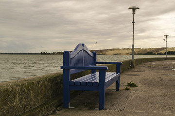 Fototapeta na wymiar In blue-painted wooden bench,Nida