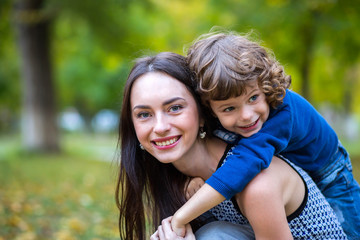 Fototapeta premium Portrait of fashionable baby boy and his mother