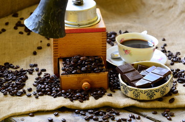 Set of breaking time coffee with coffee mill and rustic bell.