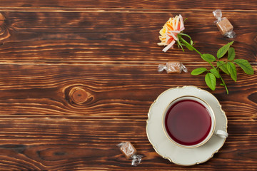 Tea Cup and Plate Of Fine Bone China. Sweets. Rose. Burnt Wooden