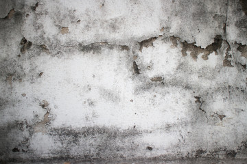 Weathered moldy detail of old colonial wall in Southeast Asia