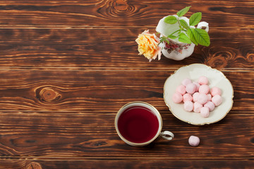 Tea Cup and Plate Of Fine Bone China. Sweets. Rose. Burnt Wooden