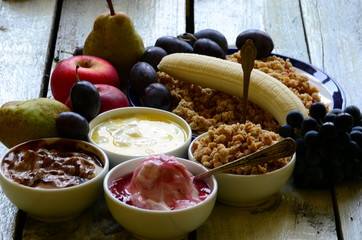 Fruit muesli with yogurt and cereals for breakfast