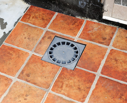 Rain drain in the courtyard of a house