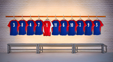 Row of Blue and Red Football Shirts hanging on Wall in Changing Room with Bench