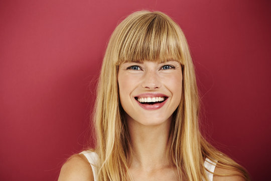 Young woman laughing in studio