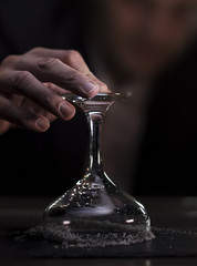 Bartender preparing his glass to serve his drink to the customer