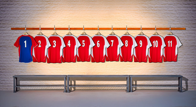 Row of Red and Blue Football Shirts hanging on Wall in Changing Room with Bench