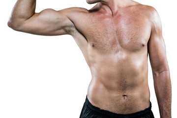 Fototapeta na wymiar Midsection of shirtless athlete flexing muscles