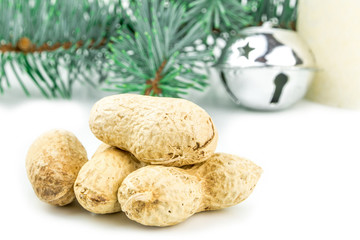 four peanuts in shell and christmas decoration 
