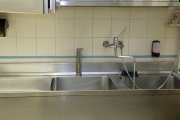 large stainless steel sink of industrial kitchen