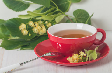 Red cup of linden tea