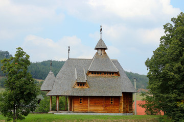 Fototapeta na wymiar old orthodox wooden church on hill
