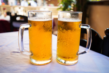 Two pints of beer on the restaurant table