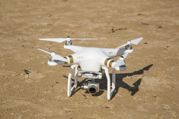Fototapeta na wymiar drone standing in the sand at the beach