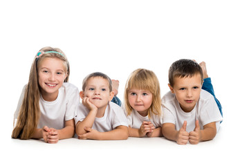 smiling children lying on the floor