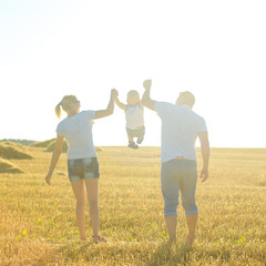 happy family at sunset