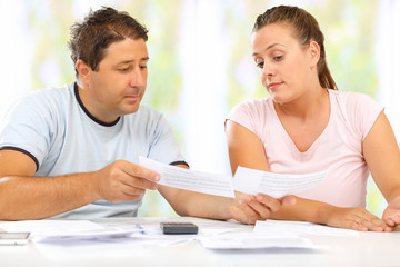 Fototapeta premium Man and woman discussing their home economy 