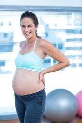 Fototapeta na wymiar Portrait of smiling pregnant woman 