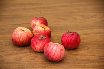 Autumn. Red apples fall to the ground.