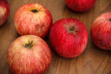 Autumn. Red apples fall to the ground.