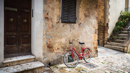 Abandoned bike on the Italian street in the old Tuscany
