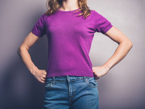 Confident young woman in purple