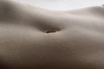 detail the navel of a woman with white background - obrazy, fototapety, plakaty