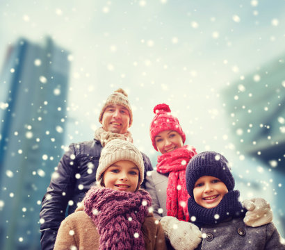 Happy Family In Winter Clothes Outdoors