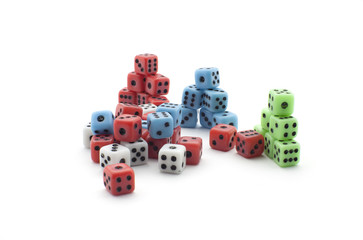 Red, blue and green dices in a triangle shape