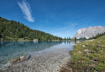 idyllic mountain lake at austrian alps with blue sky