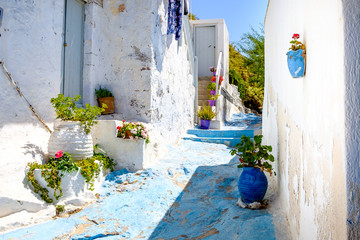 Beautiful street in old traditional Greek cycladic village Plaka