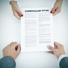 Obraz premium young woman and man with a curriculum vitae