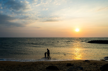 Fototapeta premium father and daughter at beach sun set 2
