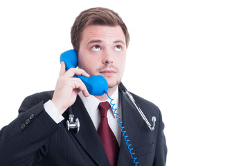 Naklejka premium Medic or doctor answering and talking on the phone