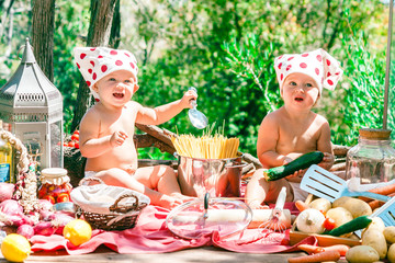 Happy children cook. Funny kids playing outdoors. Summer vacation concept