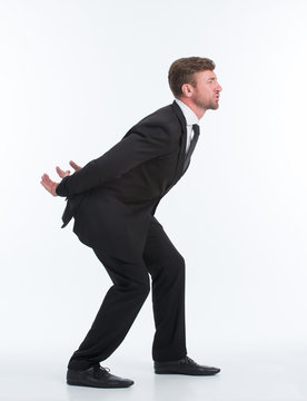 Businessman Carrying Heavy Load On His Back