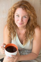 Middle-aged woman with a cup of tea