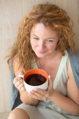 Middle-aged woman with a cup of tea
