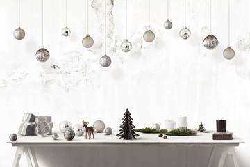 Christmas decoration on a table with hanging Christmas balls - silver and white