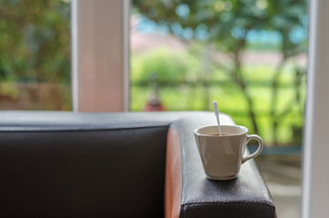 atmosphere around office blur background with bokeh and cup of c