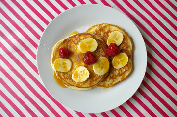 Breakfast crumpets with banana and strawberry