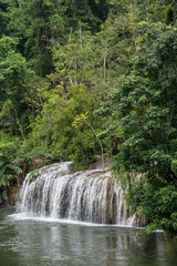 Fototapeta premium Sai Yok Yai waterfall flows directly into Khwae Noi River, Sai Yok National Park, Kanchanaburi, Thailand